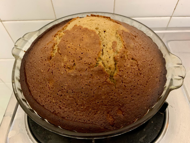 Olive oil pound cake in a circular glass baking dish