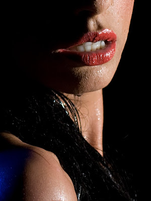 Water pouring on woman at boudoir shoot