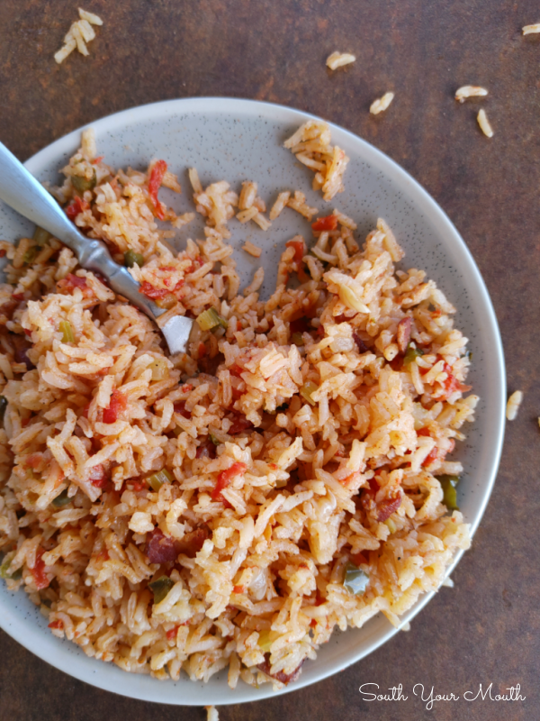 Charleston Red Rice! A Lowcountry recipe popular from Charleston to Savannah, made from rice cooked with bacon and a tomato broth seasoned with peppers and onions perfected by the Gullah and Geechee.