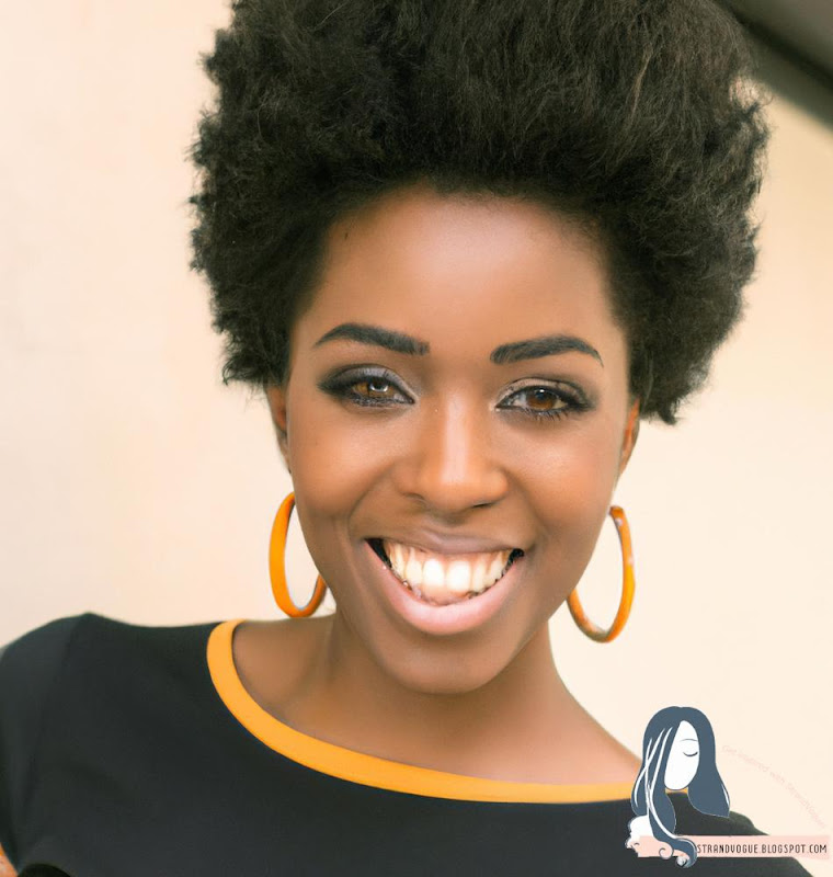 The Afro Puff hairstyle on a beautiful black woman with a huge smile