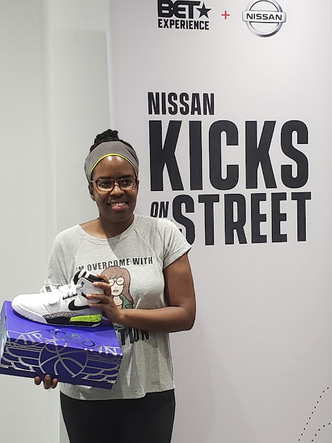 A Kicks on the Street raffle winner with her Nike Just Don Legacy 312 sneakers