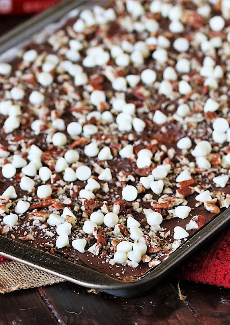 Ritz Cracker Candy with White Chocolate Chips and Pecans in Baking Pan Image