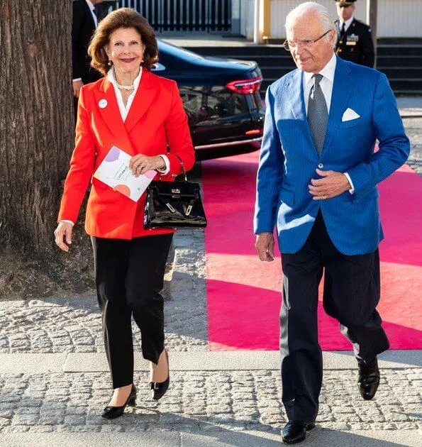 Crown Princess Victoria wore a rose Odnala wool coat by Andiata. By Malina Adele dress. Queen Silvia wore a red blazer