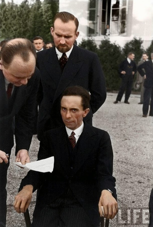 28 Realistically Colorized Historical Photos Make the Past Seem Incredibly Alive - Nazi Minister of Propaganda Joseph Goebbels scowls at a Jewish photographer, 1933