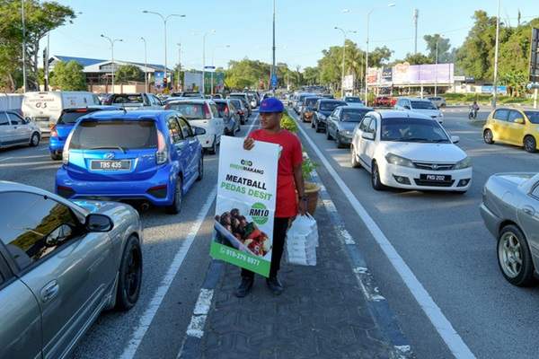 penjual lampu isyarat