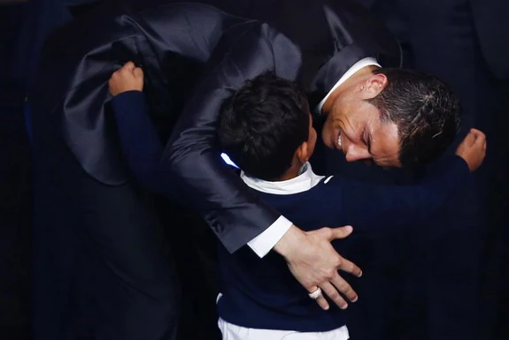 Cristiano Ronaldo embraces his son after being awarded the FIFA Ballon d'Or 2013