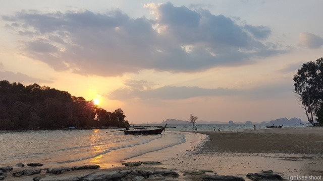 Longtail boat and Sunset as viewed from Nakamanda Resort, Klong Muang beach