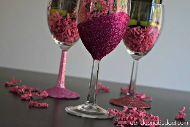 #ad Looking for a sparkling DIY? Check out these glitter wine glasses -- with an added sparkling juice -- from www.abrideonabudget.com. #dollartree