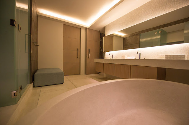 Picture of large modern bathroom at night