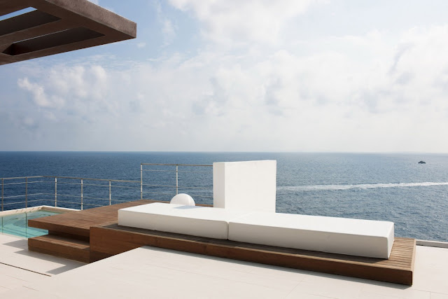Outdoor bed on the terrace above the sea 