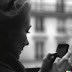 Photo of a woman watching her iPhone…