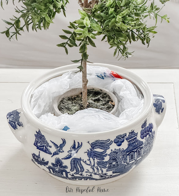 chinoiserie cachepot plastic garbage bags topiary in pot.