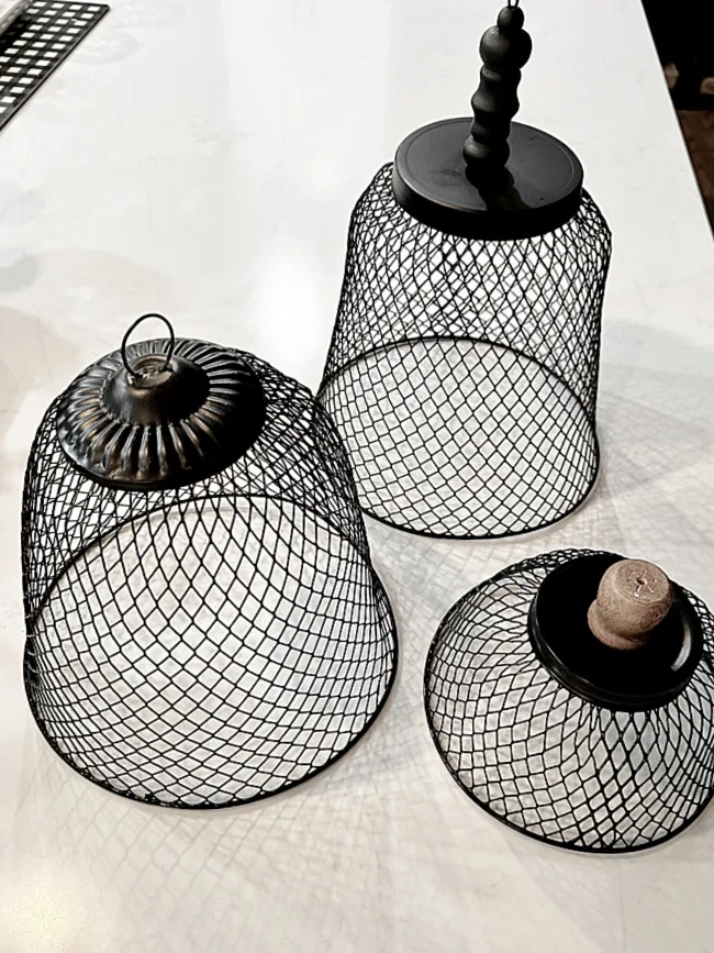 black cloches with different tops