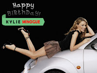 kylie minogue, spicy babe lying on belly onto car bonnet in black top and brown skirt with high heels sandal