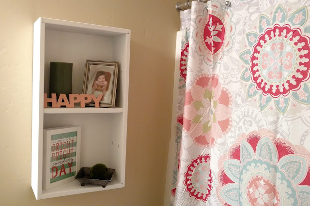 An old crate and a little chalk paint can transform into a fun and functional shelf for your bathroom!