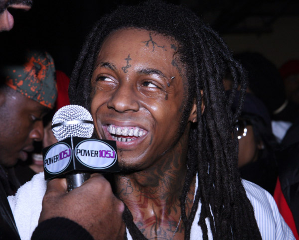 Artist Name: Lil Wayne Tattoo Description: Back tattoo are