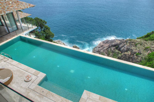 Swimming pool on the cliff above the ocean 