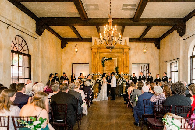 bride and groom holding hands at ceremony