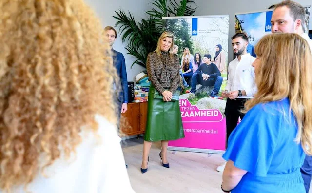 Queen Maxima wore a geometrical print viscose blouse by Natan. Gianvito Rossi navy leather pumps. Natan skirt