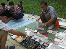 Flea Market Crowd selling Stamps, Coins, Currency Notes