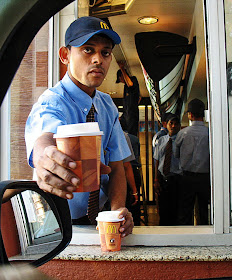 Serving coffee at drive-thru