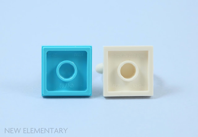 the undersides of 2 lego pieces that are based on a 2x2 tile