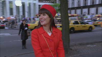 Rachel wearing a vintage red cap and petticoat as she looks around New York