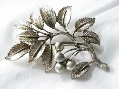 Silver cherry leaf brooch by Exquisite