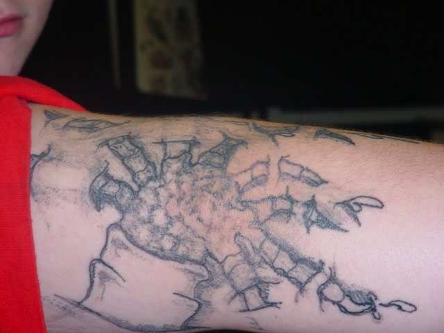 "Bad (Not Bad Ass) Tattoo" : Reptile Fingers? http://gradeatattoos.com/ I'm not even sure what the hell this is a tattoo of, but it looks like it involves 
