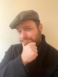 Author Matt Wainwright in a flat cap