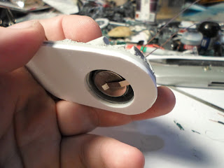 a Dragon Forg Base with a space drilled out to accomidate a button battery