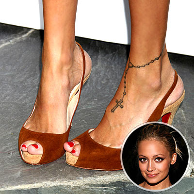 Reminds me of one of my fav celeb tattoos, Nicole Richie's crucifix tat