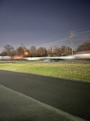 A train going over nana’s tracks at night.