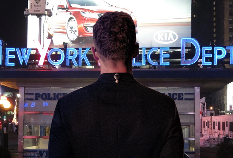 The shot of Justin Timberlake from his album cover ‘Everything I Thought It Was’. Except instead of him stood before a diorama of a desert, he is stood before the New York Police Dept. substation in Times Square. [This image was Photoshopped by Random J]