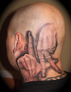 Fingers tattoos on head