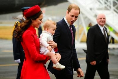 Catherine (L), carrying baby Prince George,