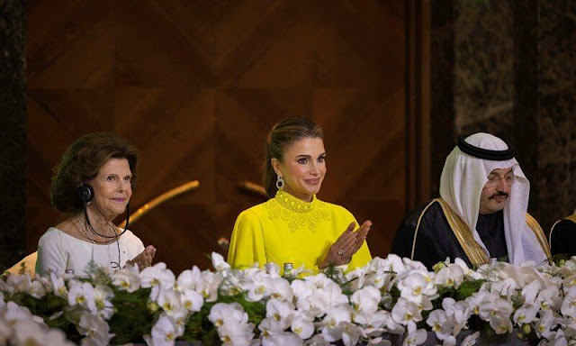 Queen Rania wore a Crista camel stripes dress by Silvia Tcherassi. Andrew GN yellow beaded jewel-collar draped slit-sleeve top blouse