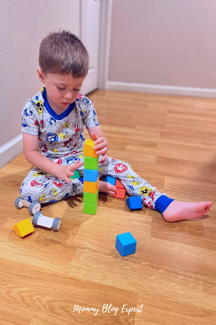 Boy Playing With Magnetic Toy Building Blocks