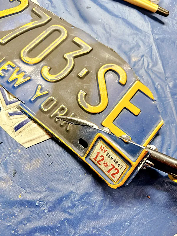 cutting license plate with tin snips