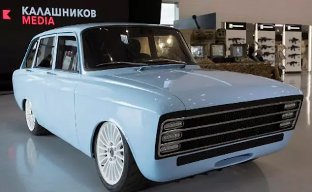 A handout photo shows a retro-looking pale blue prototype electric car, produced by Kalashnikov.