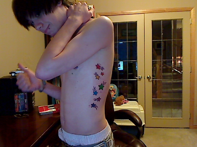 gay pride tattoos. lower back dragon tattoo and