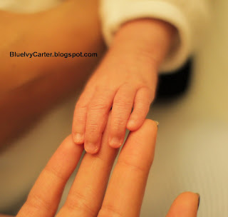 First picture of baby Blue Ivy fingers touching Beyonce fingers