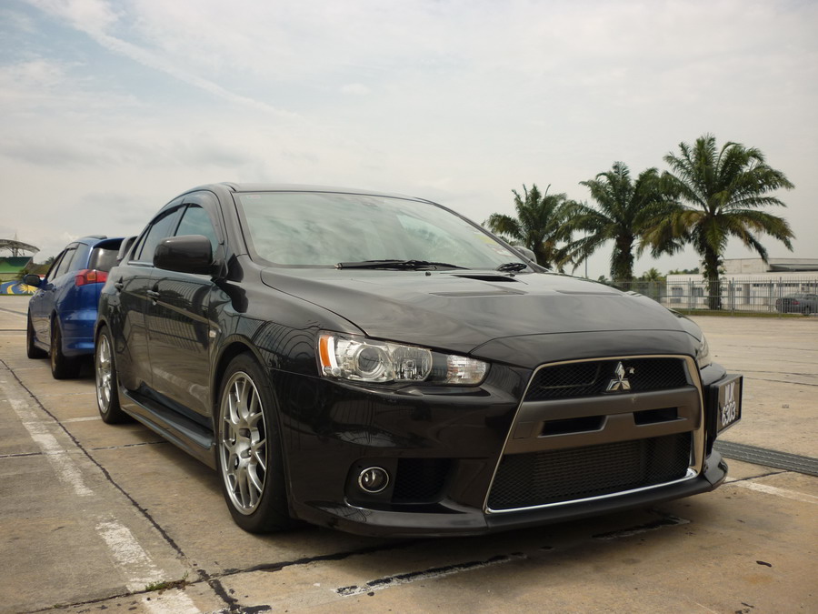 A black color Mitsubishi Lancer Evolution X spotted in car park of Sepang 