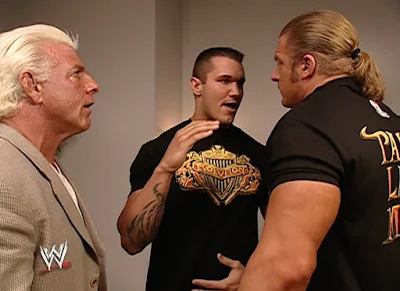 WWE Summerslam 2003 - Ric Flair and Triple H warn Randy Orton to know his role in the elimination chamber match