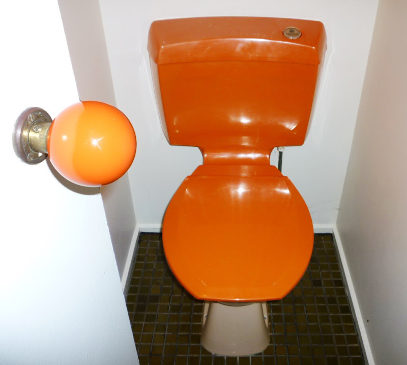 1970's beach house with classic orange caroma loo. title=