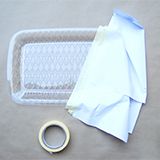 Transparent tray masked with paper