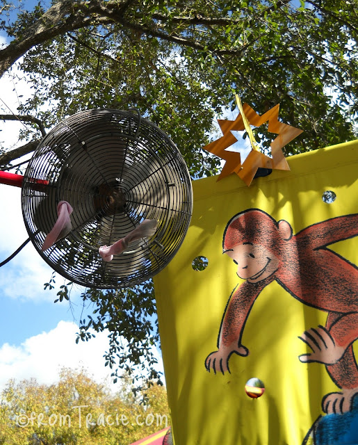 Two socks hanging from a fan