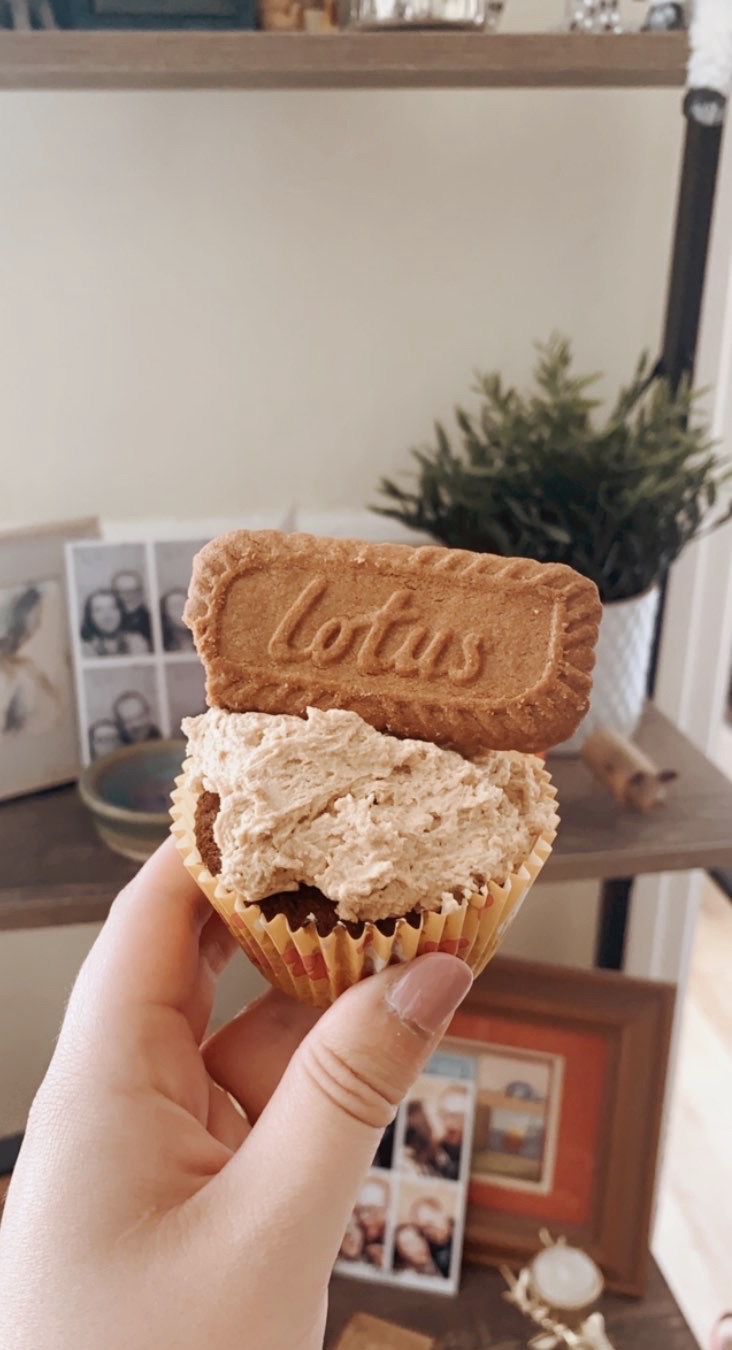 Cupcake with icing and lotus biscuit on top