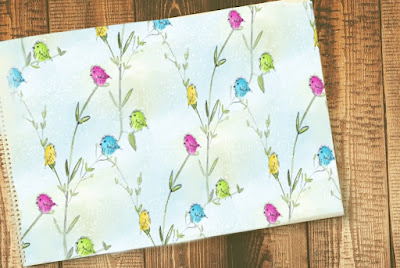 Mockup of a notebook with a "bird and branch paper" cover.