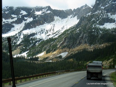 Behind the truck and road cut